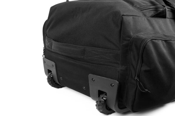 Black trolley bag on a white background, showing the wheels