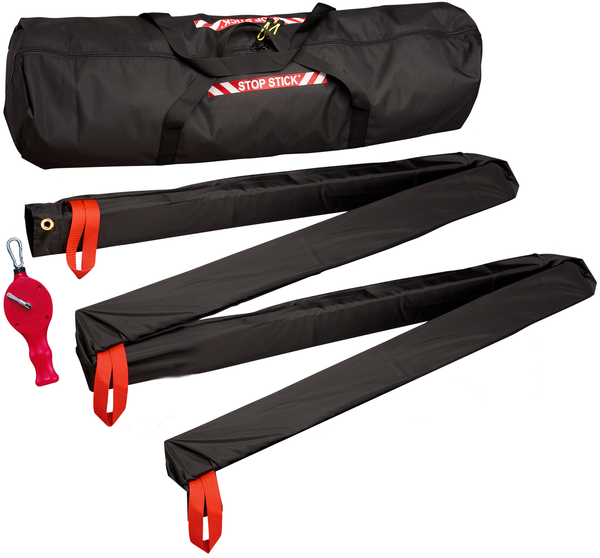 Stop stick inside black storage bag, next to black cover and red real